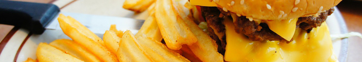 Eating American (Traditional) Burger Pub Food at Osoyami Bar and Grill restaurant in Honolulu, HI.